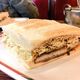 Miso katsu sando with chopped cabbage served on toasted bread.